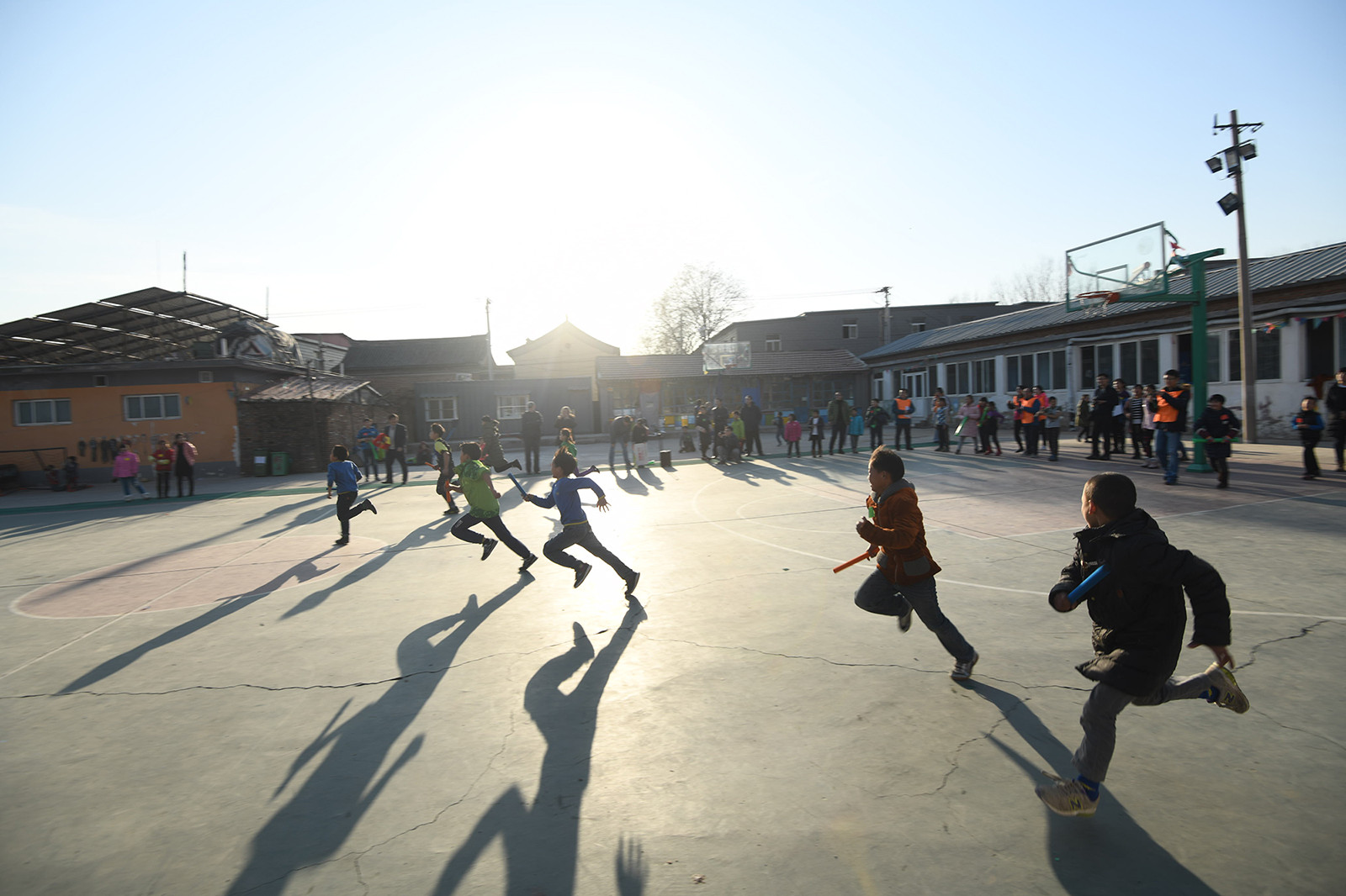 children running across playground