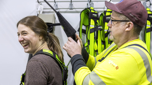Trainer Risto St. Luise prepares Molly for a practice run on the Slip Simulator.