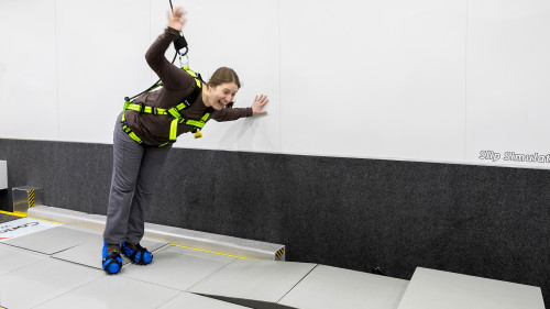 Molly slips on the Slip Simulator. 