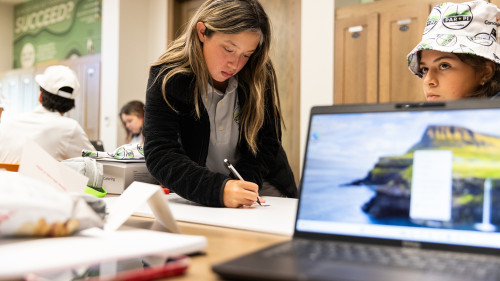 A student of the Par + Pi program working out a math problem