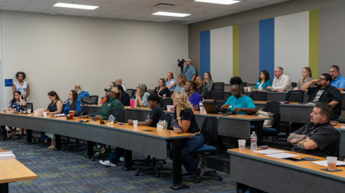 The auditorium filled with participants waiting to graduate.