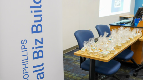 ConocoPhillips Small Biz Builder logo banner at the graduation ceremony.