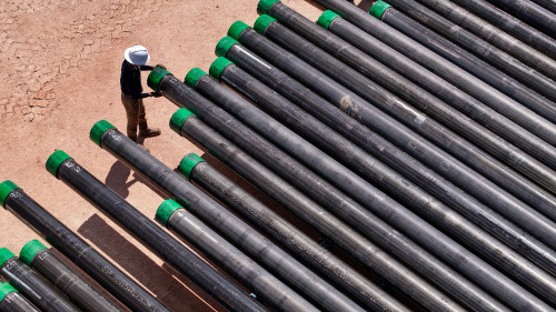 Engineer inspecting well casing 