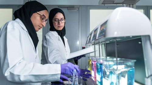Process Lab, Scientist Eman and Engineer Mashael with Dissolved Air Flotation unit