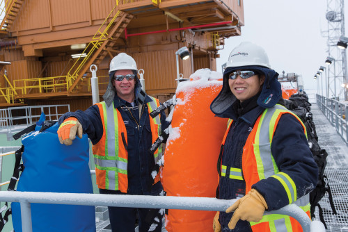 Workers on site in Alaska suited up in winter gear