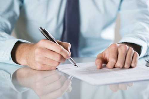 man filling out forms