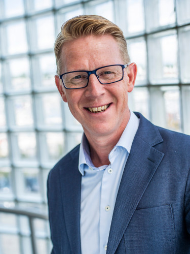 profile photo of Jan-Arne wearing glasses in front of a glass wall