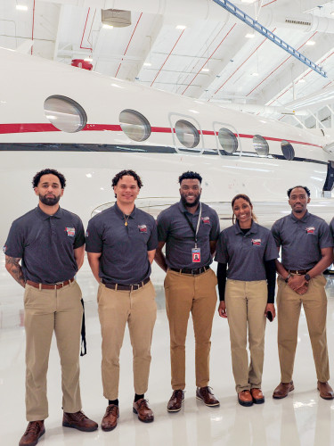 Photo of RedTail Flight Academy students at Houston hangar.