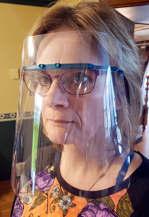 Cheryl Saverud models a face shield