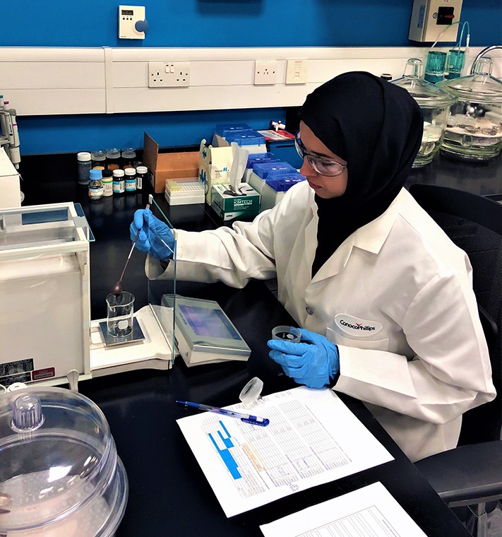 Eman Al Shamari testing water in a beaker