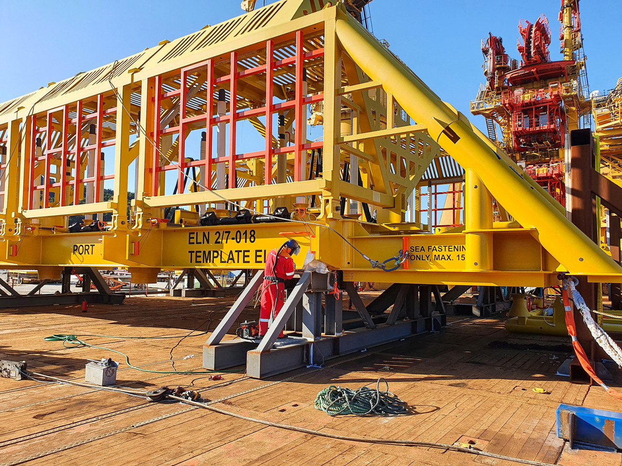 a worker welding on a platform