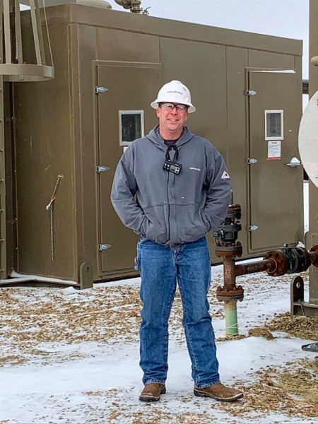 Grabow standing outdoors with heat treater equipment in background