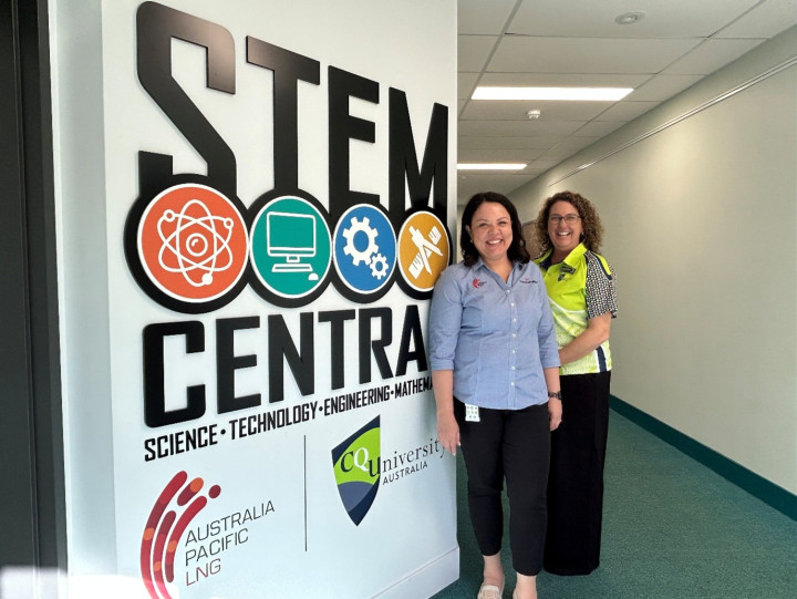 STEM teachers smiling in a hallway