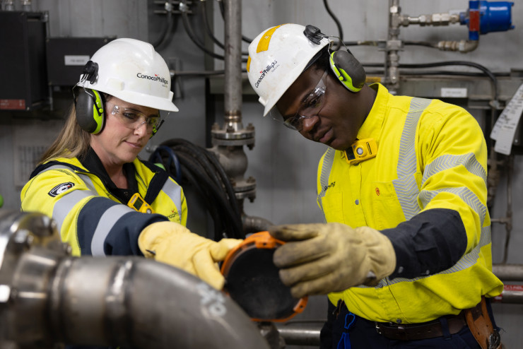 ConocoPhillips workers checking equipment. 