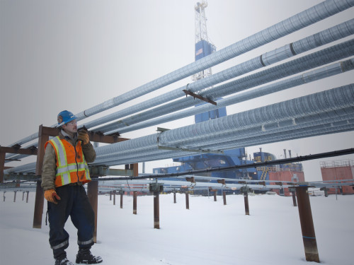 North Slope worker walks near a ConocoPhillips drill site.