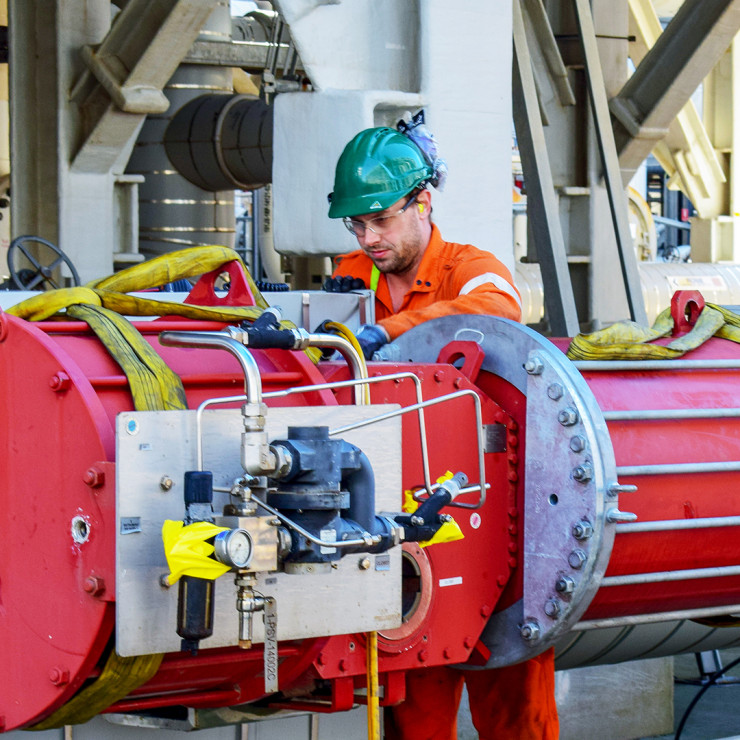 An employee working on an actuator replacement