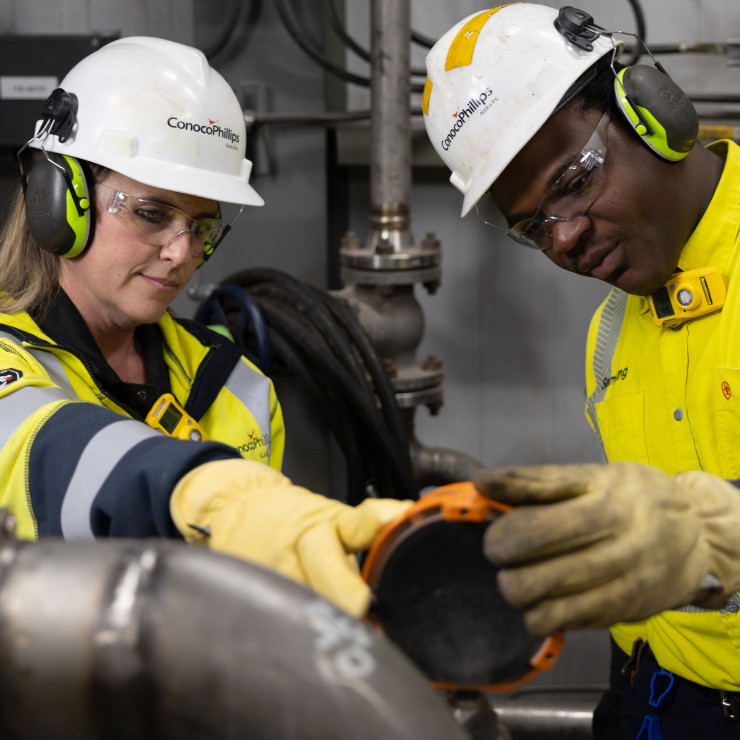 ConocoPhillips workers checking equipment. 