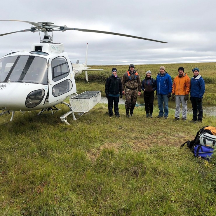 Fish biologists and ConocoPhillips personnel at a sampling site pre-pandemic