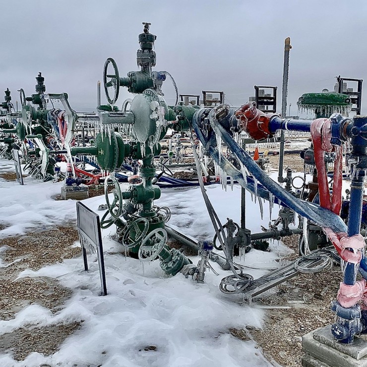 Oil field equipment frozen in ice. 