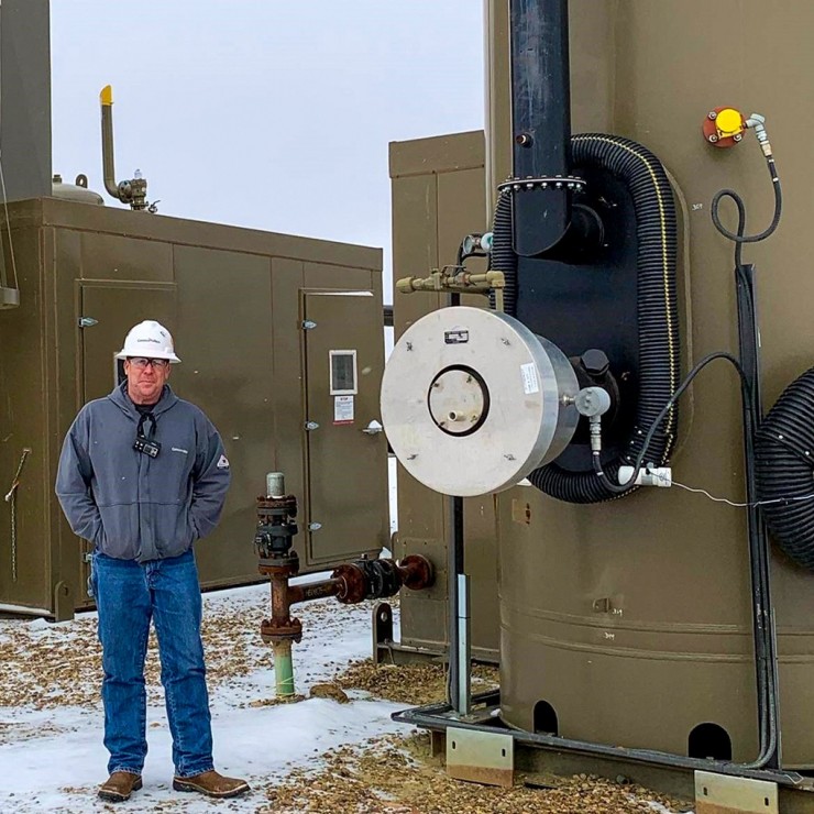 Image of Jeremy Grabow standing on a Bakken well pad.