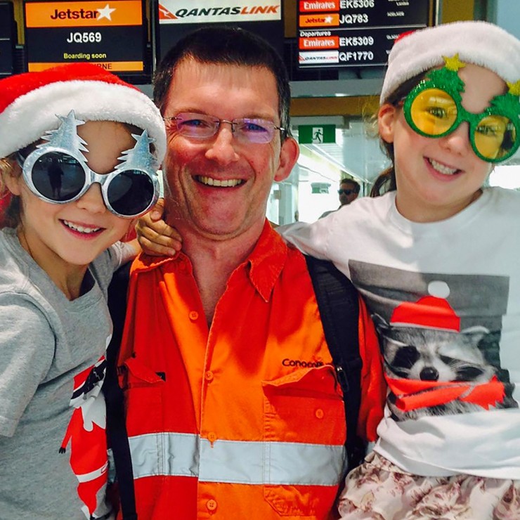  Keith Frame greets his daughters, Alice (left) and Katie, at the Brisbane Airport.