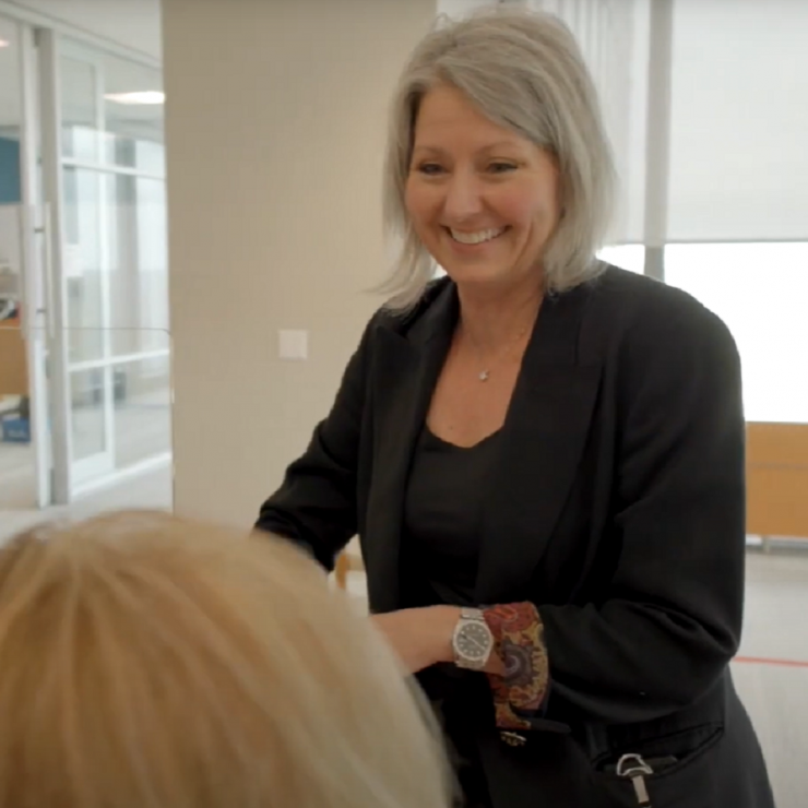 Lori Woodward having a conversation smiling