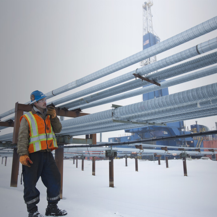 North Slope worker walks near a ConocoPhillips drill site.