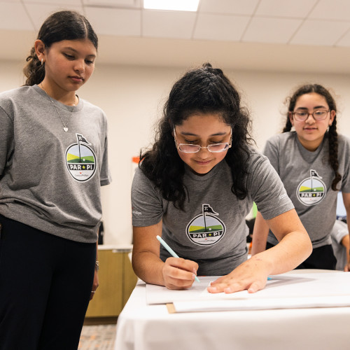Par + Pi student participants (from left) Emma Pecina, Amora Cicchetto and Olivia Carillo work together to design a geometrically accurate golf course hole.