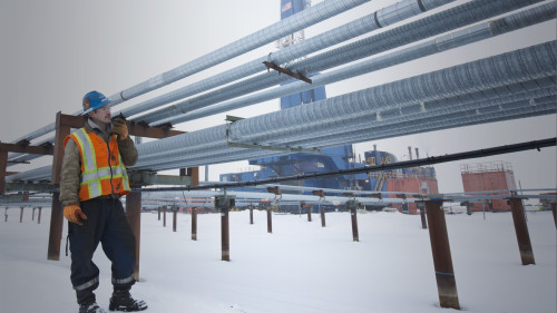 North Slope worker walks near a ConocoPhillips drill site.